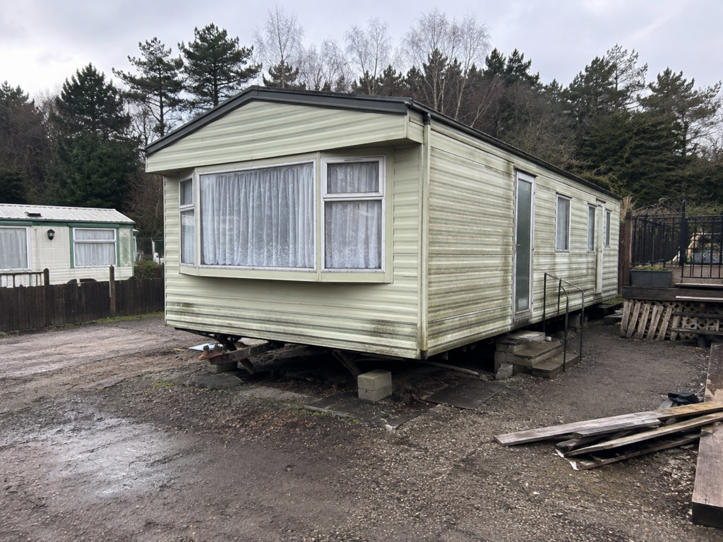Old damaged static caravan to sell for scrap